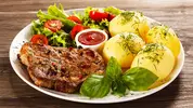 meat, steak, potatoes, salad, tomatoes, tomato sauce.jpg