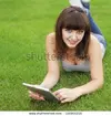 stock-photo-beauty-girl-with-tablet-pc-outdoors-116956216.webp