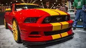 red-custom-mustang-yellow-stripes.webp